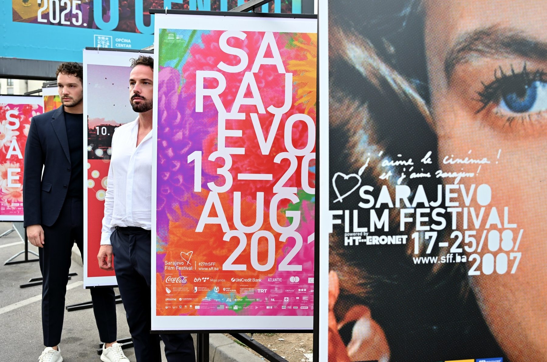 Two men beside Sarajevo Film Festival posters